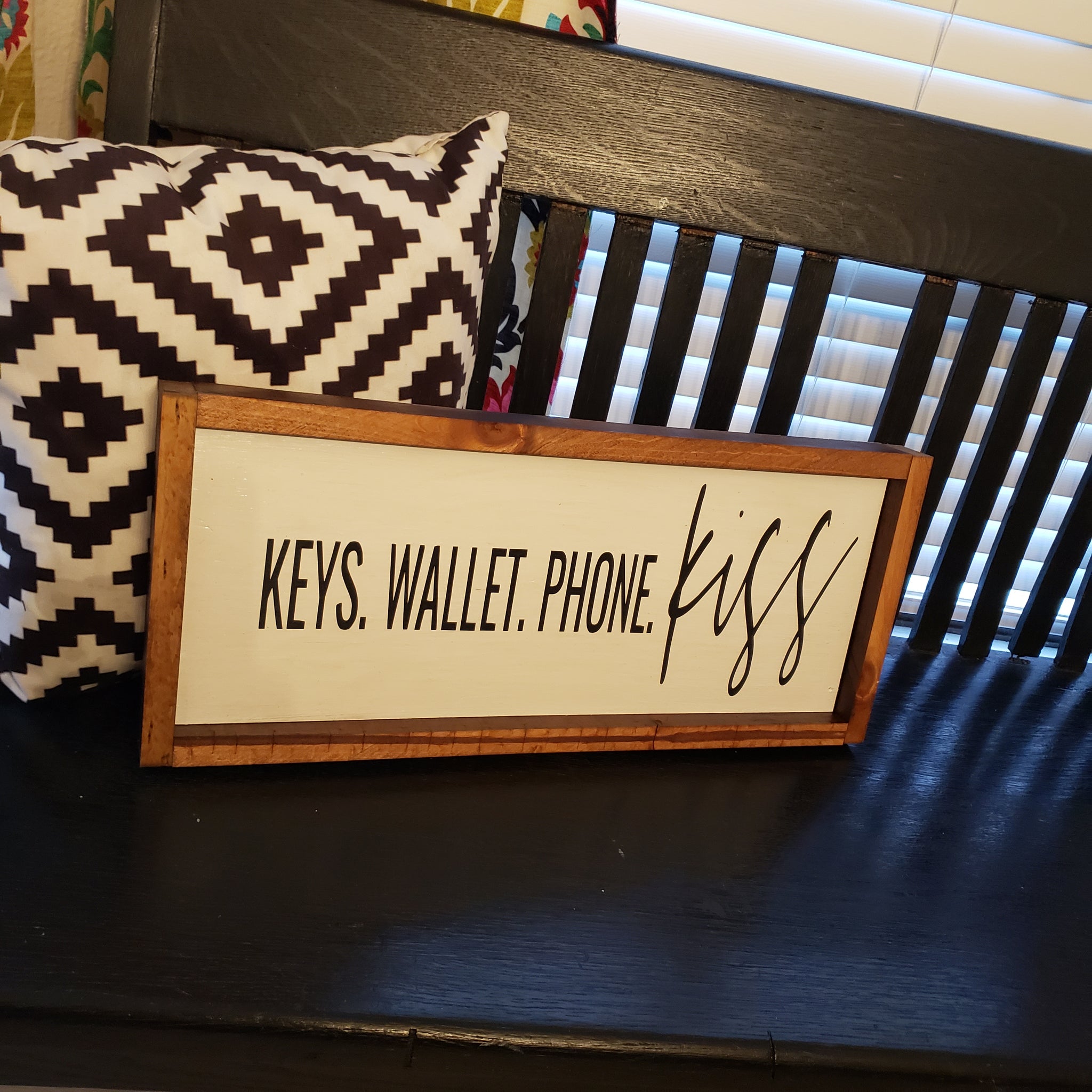 Keys. Wallet. Phone. Kiss. Sign